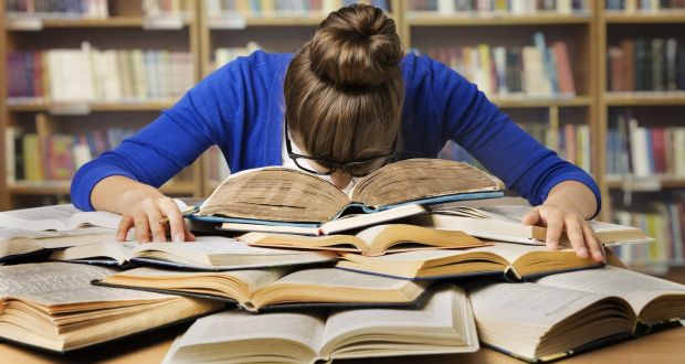 A Teenage Girl Getting Tired Due To Exam Stress While Preparing For Her Competitive Exam.